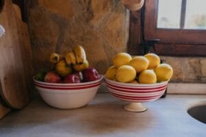 Bowl of ripe fruit on a kitchen counter, a common source of fruit flies